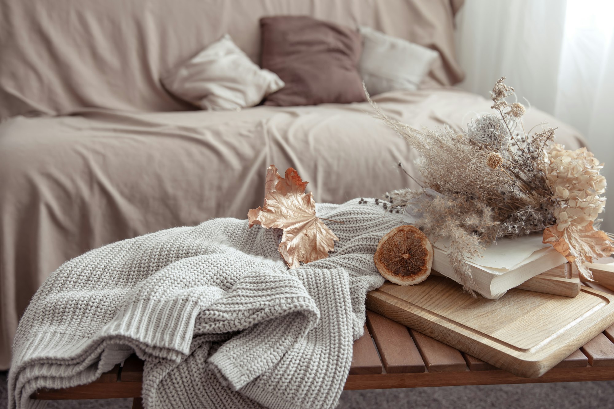 Fall vibe with fall decor details and a knitted sweater in the room.