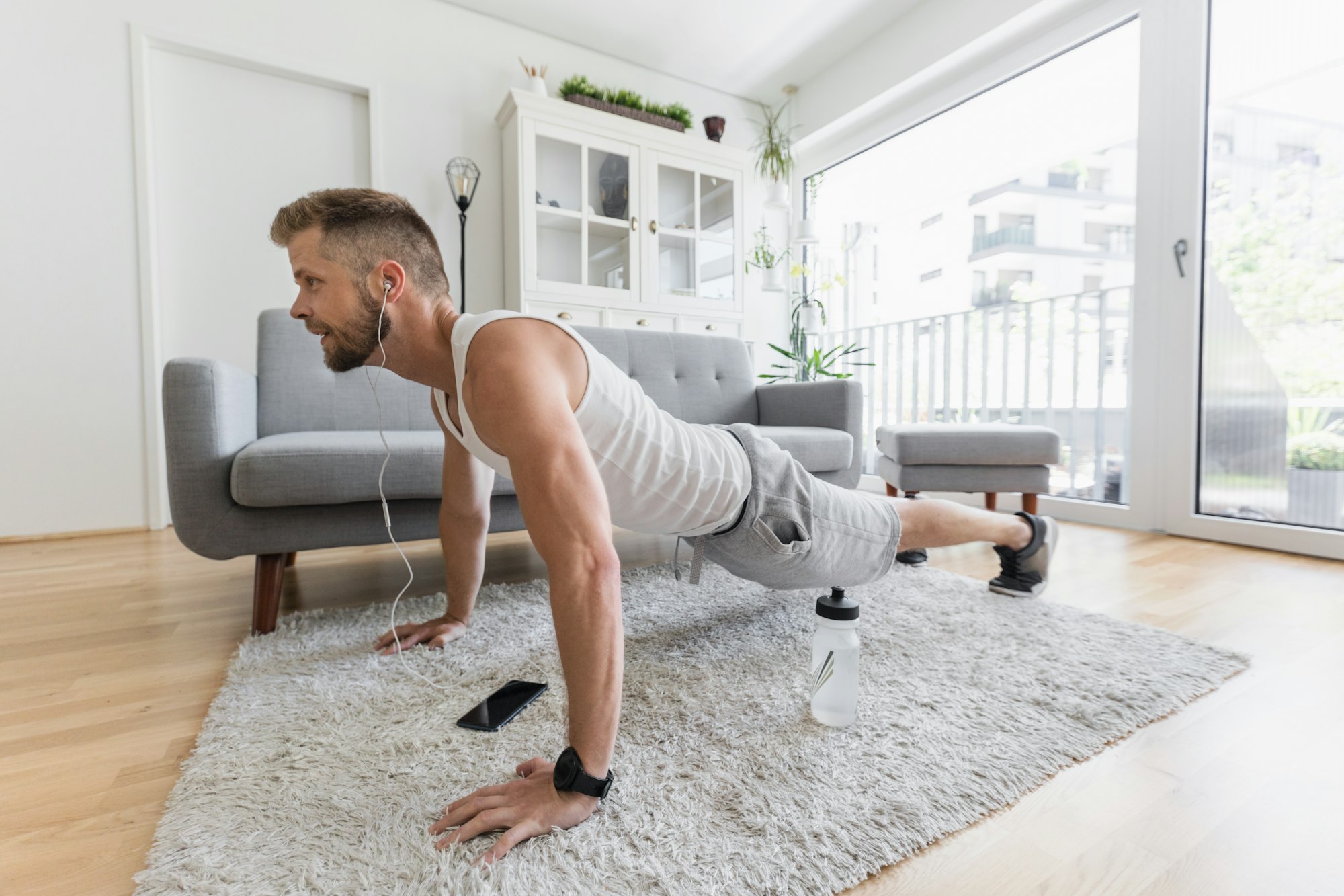 Handsome man working out at home